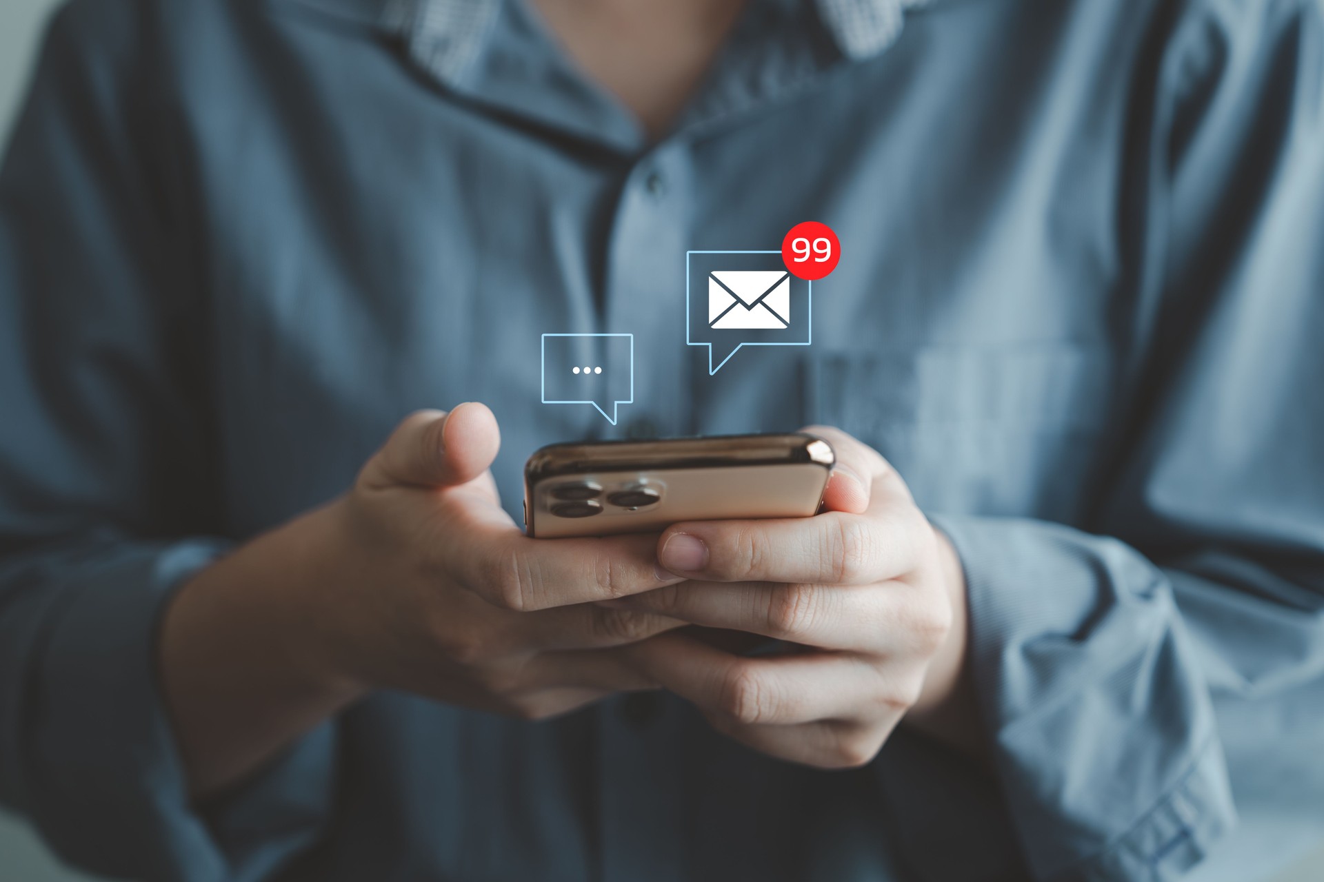 Woman hand using mobile smartphone receive new message and 99 new email alert sign icon pop up.